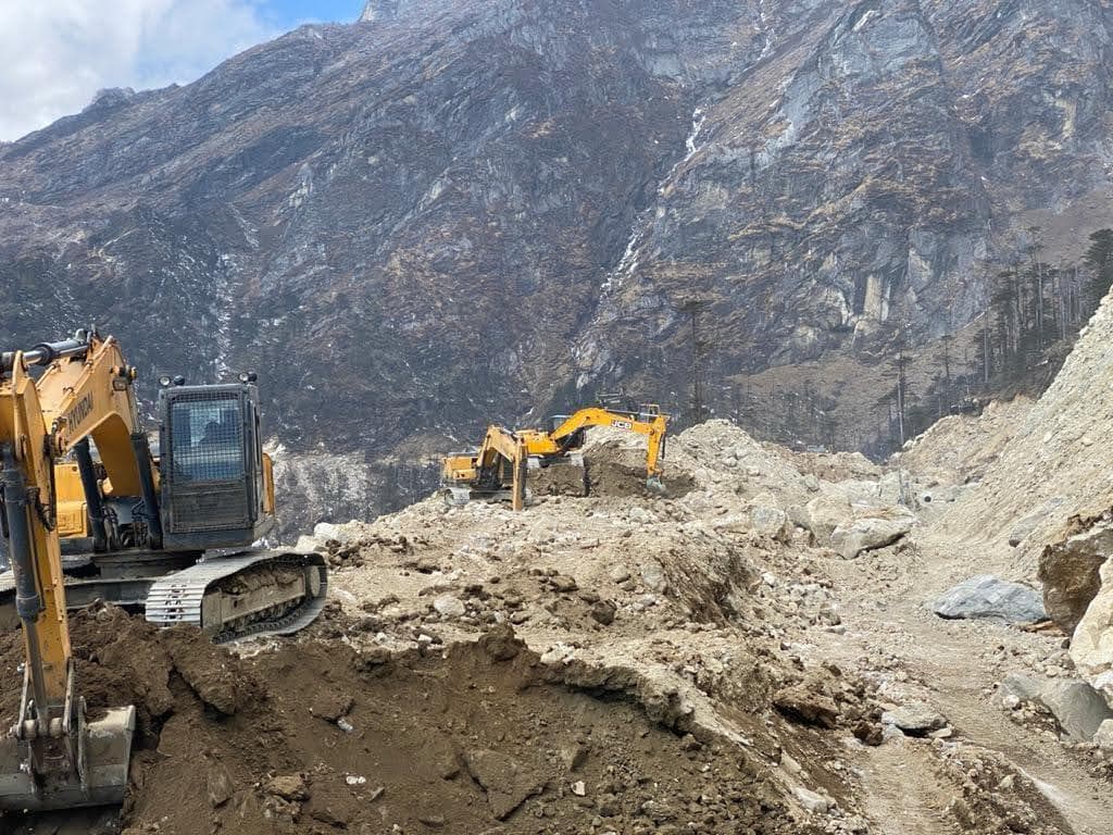 Heavy machinery at mountainous construction site